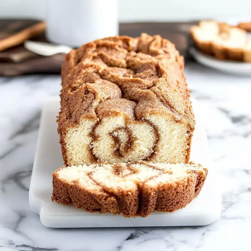 Delicious cinnamon swirl vanilla pound cake slice on a plate
